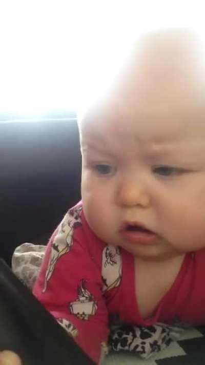 Baby hits herself with a TV remote