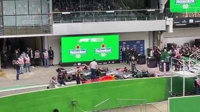 Max checking Lewis' rear wing after the quali