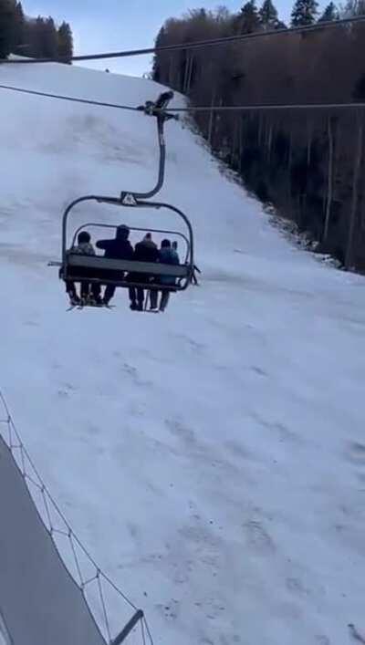 A bear chasing a skier