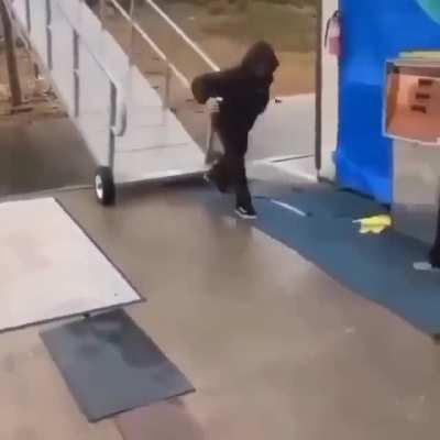 Sliding down a wet metal ramp