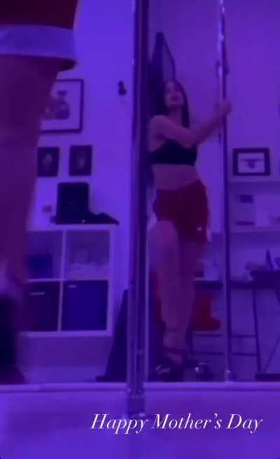 Addison dancing around a pole