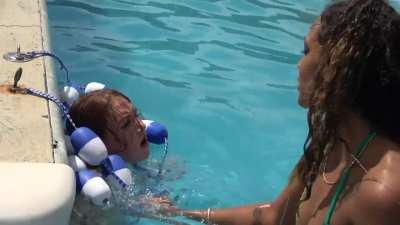 Poor redhead tied up and taunted in the pool
