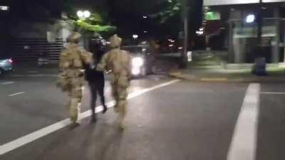 Armed troops in Portland, Oregon, are taking people prisoner in the streets while refusing to identify themselves as law enforcement and operating out of civilian vehicles. No one on scene knows what jurisdiction or capacity they are operating in, or what