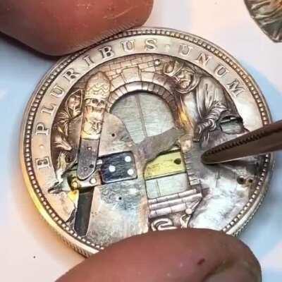 Assembling one of Roman Booteen's coins