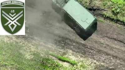 Russian soldier exiting a vehicle was hit by a dropped-grenade
