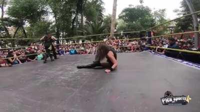 Ludark Shaitan delivers a brutal wishbone low blow to Keyra