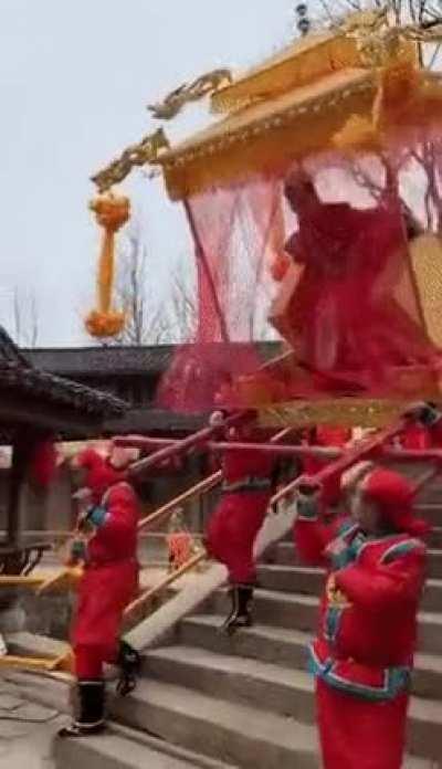 WCGW Carrying down stairs a bride palanquin in China
