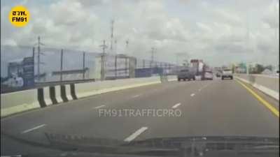 Guy tries to squeeze between two cars