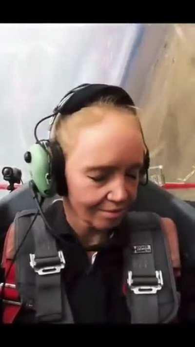 Woman appears to change from old to young due to effect of g-force on facial muscles.