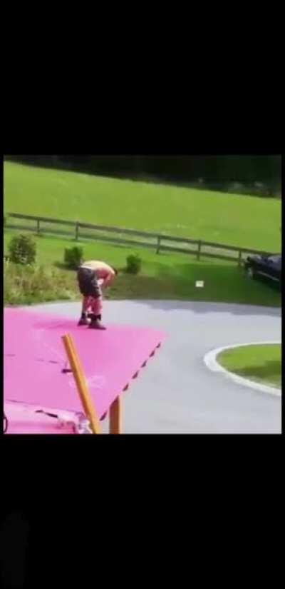 Worker syncs his work to not disturb a nearby band playing their music.