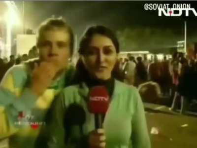 Bunch of caucasian dudes interupting a female Indian reporter
