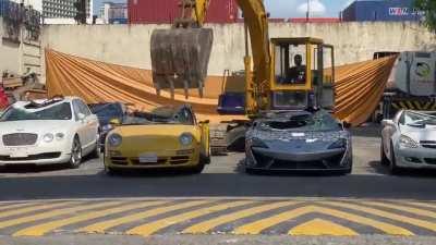 luxury vehicles including a brand new Mclaren 620R, a Bentley, a Porsche and Lotus were crushed in Philippines because they were smuggled