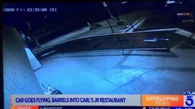 Collision between 2 cars sends one flying towards a Carl’s Jr.