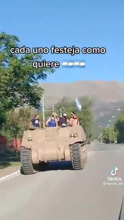 Argentinian fans celebrating in an APC