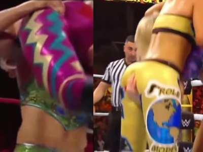 Charlotte doing what we all wish we could do to Bayley’s jiggly bubble booty