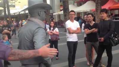 Being obnoxious around a street performer