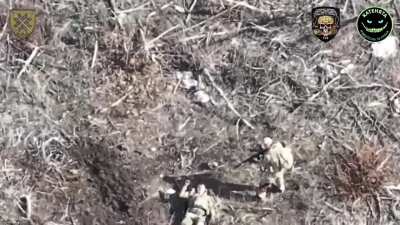 A Russian soldier finishes off his wounded comrade-in-arms with machine gun shots to the head in the Bakhmut direction