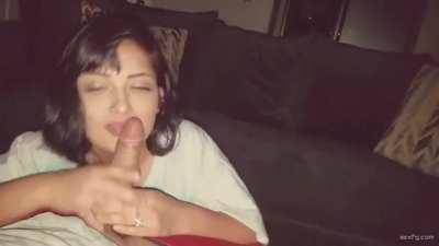 Sexy petite brunette gives a blowjob on her knees