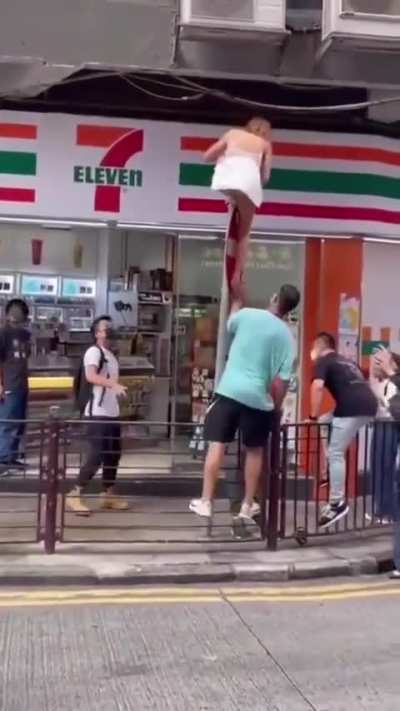 Lets all help the girl in the skimpy dress!