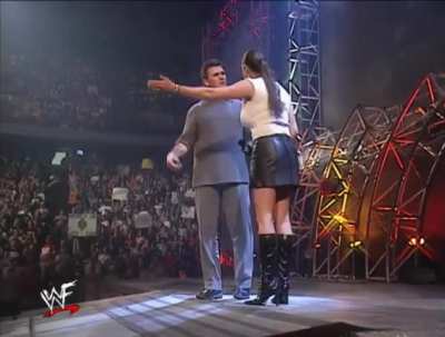 Stephanie McMahon with tight white top on