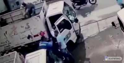 Guy on truck has a great aim to Robber!