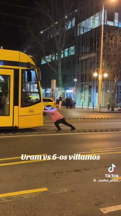 Eastern European superman vs. Tram (Budapest, Hungary)