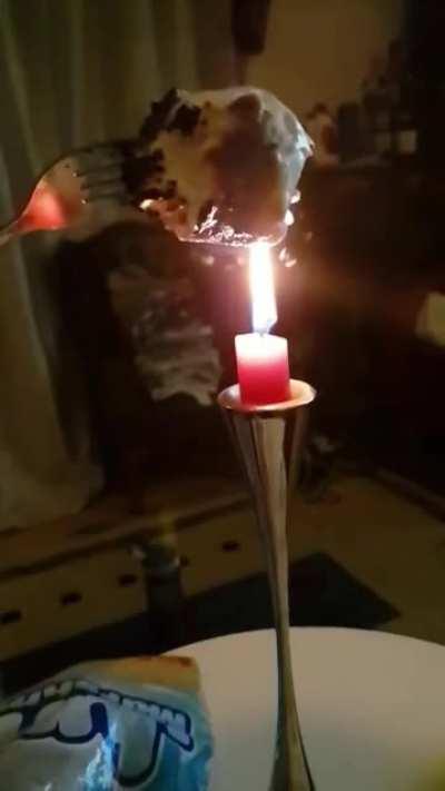 A marshmallow blows a thousand tiny smoke rings as it toasts