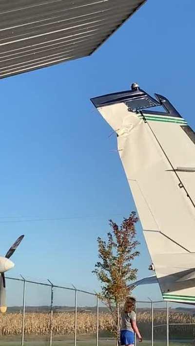 Pulling out a Cessna 340 with the hangar door not fully up.