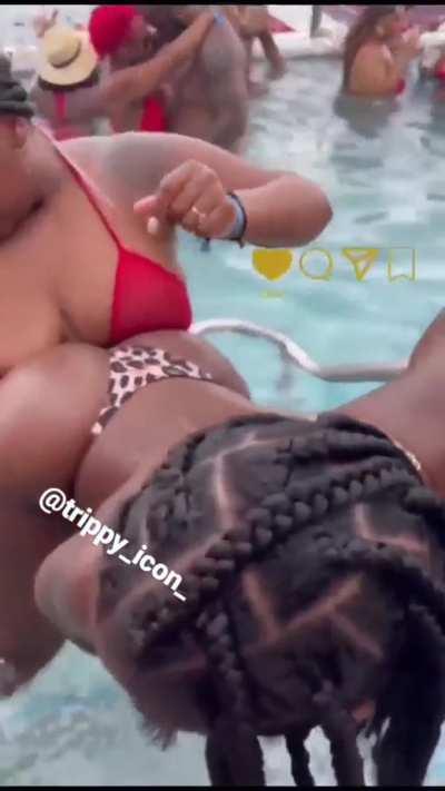 Hot lesbian couple humping at a pool party