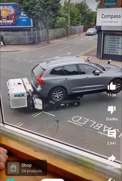 New robot in UK that removes illegally parked cars.