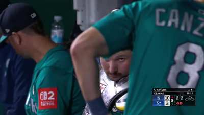 Cal Raleigh says hello to the camera despite Dom Canzone's arm getting in the way