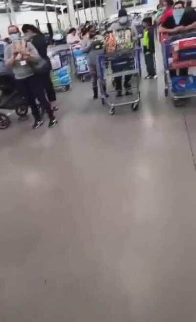 Covidiot throws a fit at Costco while wearing his mask on his hand and screams at people to make his 