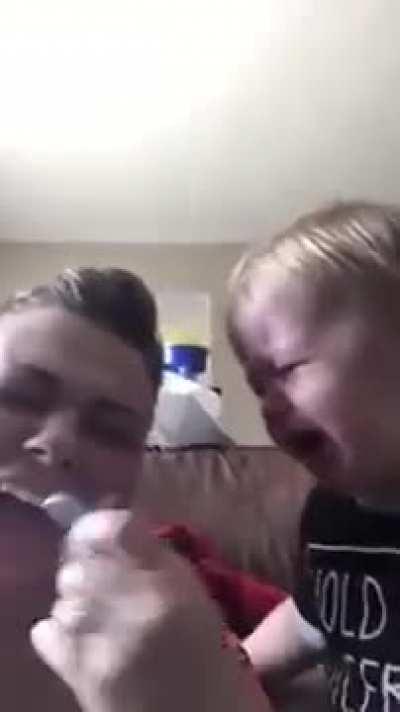 Mother and baby exchange pacifier