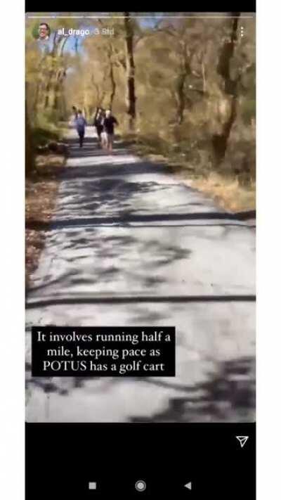 US photojournalists getting the shot of Trump golfing.