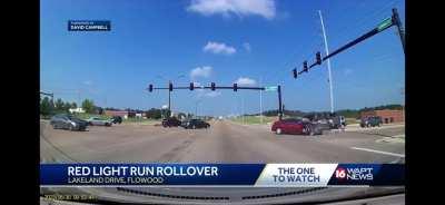 SUV hit by car that ran a red light