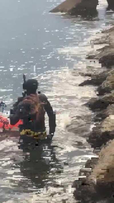 Man has an octopus stuck on his back 