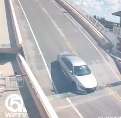 a bridge tender was terminated after a drawbridge raised with a car on it