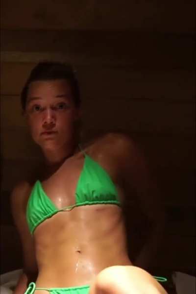 Glistening abs in the sauna