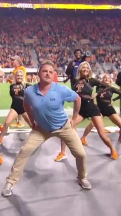 Security Guard in the way of a cheerleading routine