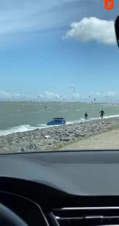 German tourists forget the handbrake when visiting the Dutch coast