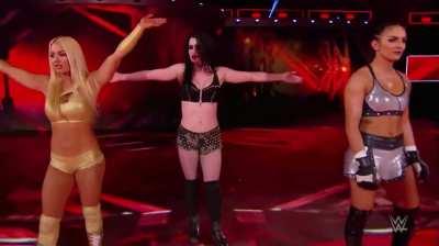 Mandy Rose, Paige and Sonya Deville standing tall on stage