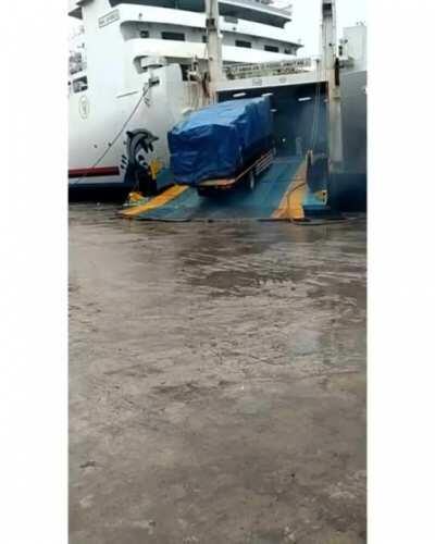 A truck falls off the harbor? Record the the ground instead