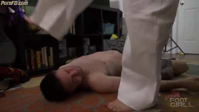 Karate girl facekicks on face