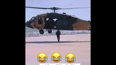 Taliban dismounting from a helicopter