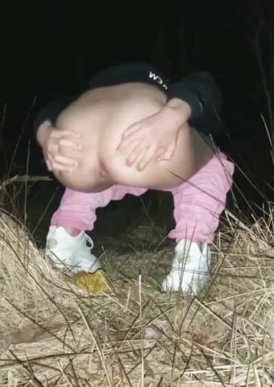 Shitting in the dark outside