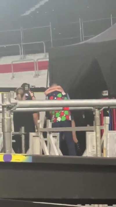 Taylor Swift running to kiss Travis Kelce after her show in Argentina