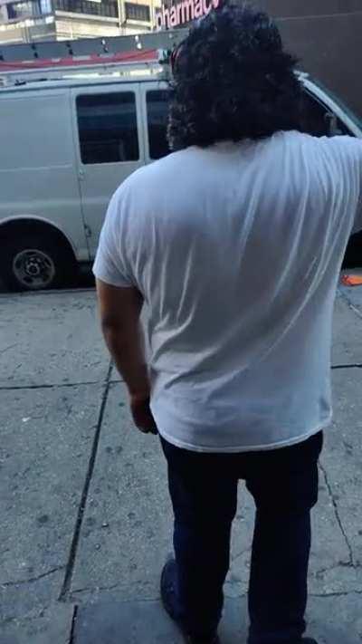 Guy (brown jacket) attacks another (blue jacket) because he won't give him money for a loosie.