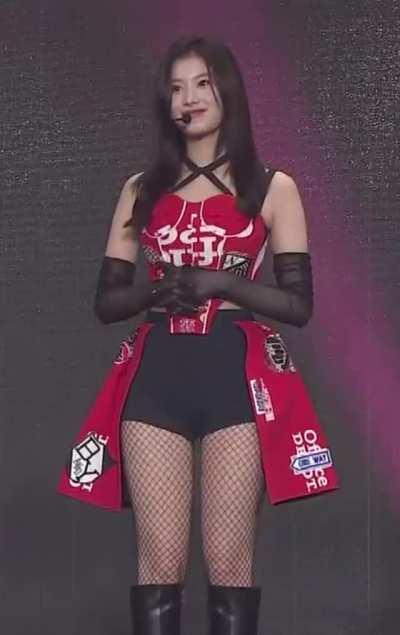 Sana - black knee-high boots, shorts, red top, Twice In Wonderland