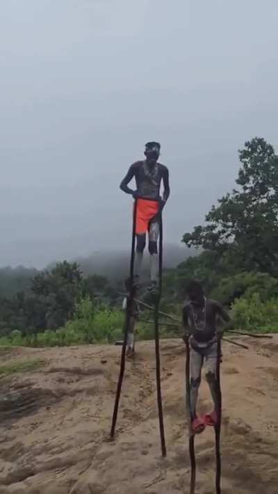 Children of the Banna tribe in Ethiopia walking on stilts