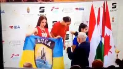 Ukrainian Boxer Diana Petrenko unfurls her Azov Battalion (Nazi) Flag